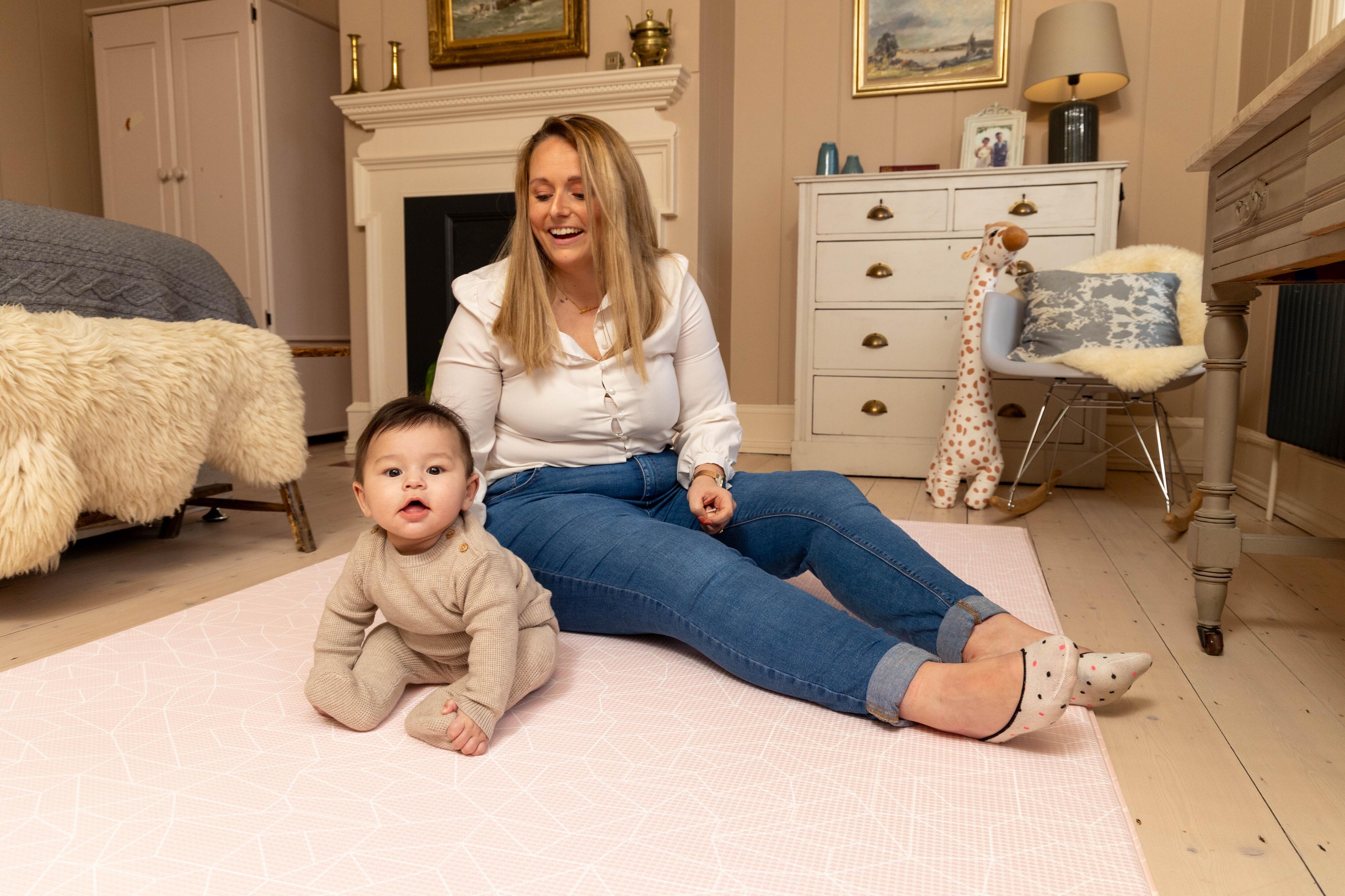 Baby playing on Blush Pink Nordic Explorer Playmat – soft wipe-clean foam mat designed for stylish family homes by Little Fae