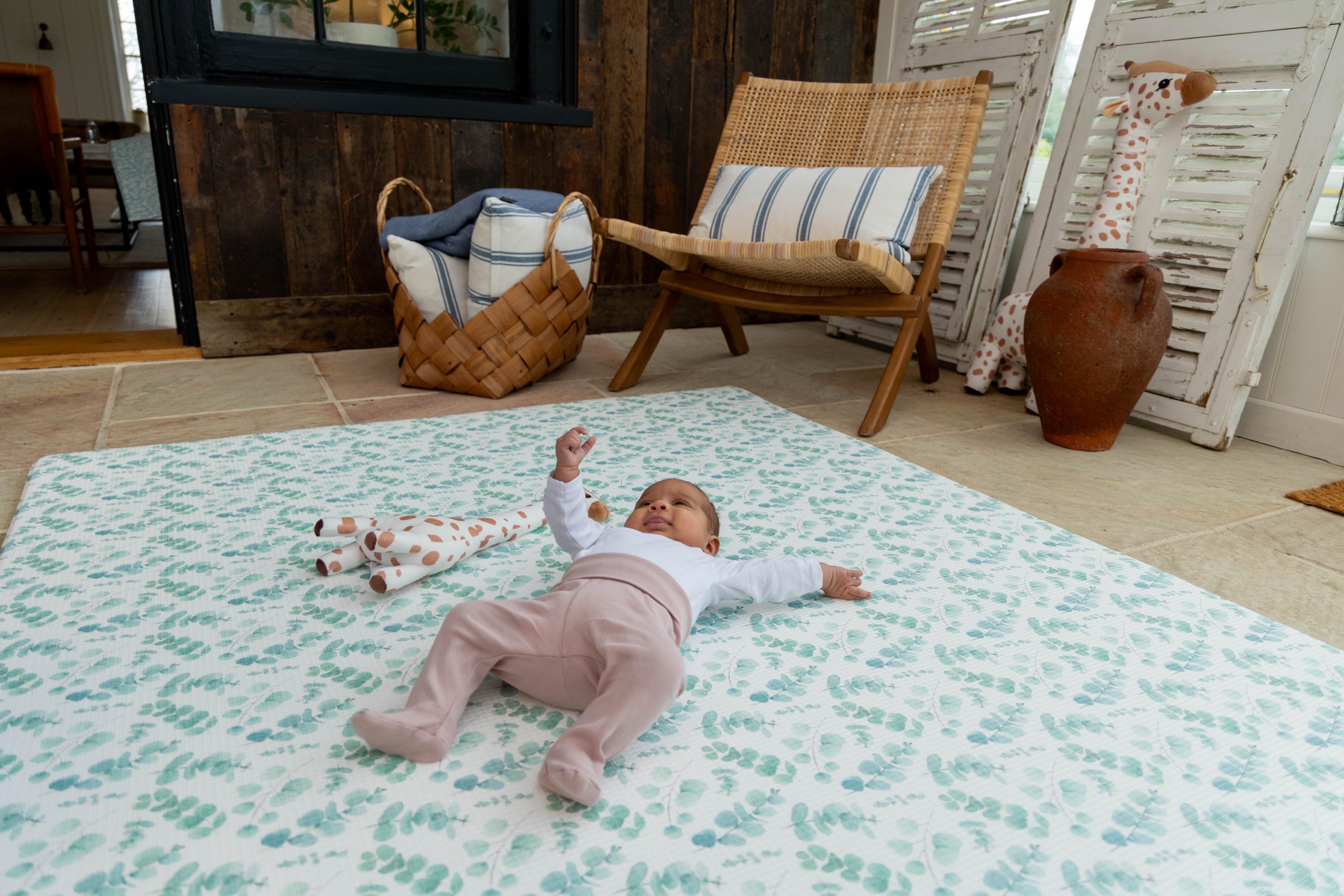 Lifestyle image of Botanical Green Fresh Eucalyptus Playmat – neutral reversible design for modern interiors