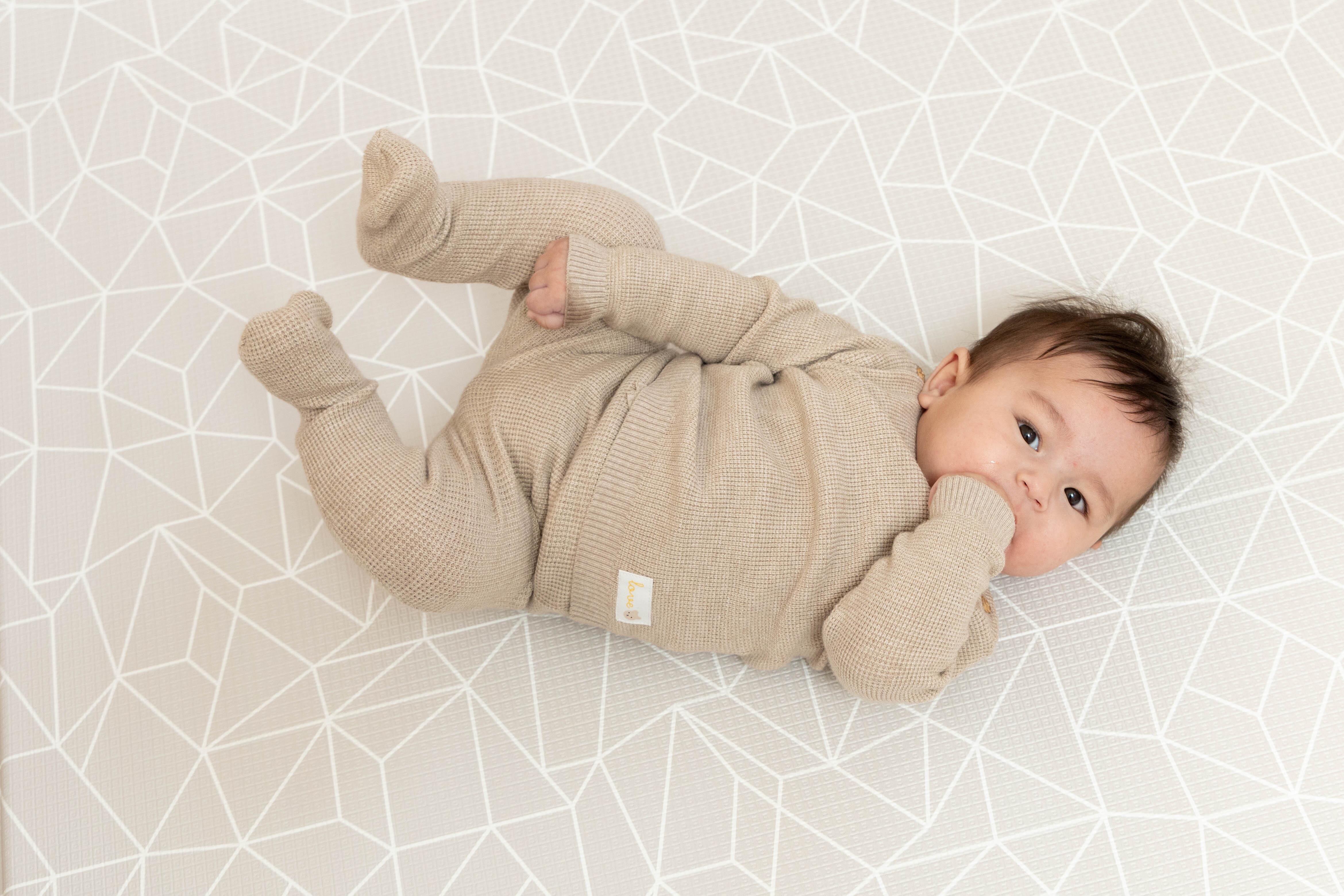 Close-up of Nordic Explorer Greige surface – matte textured non-toxic reversible baby playmat by Little Fae