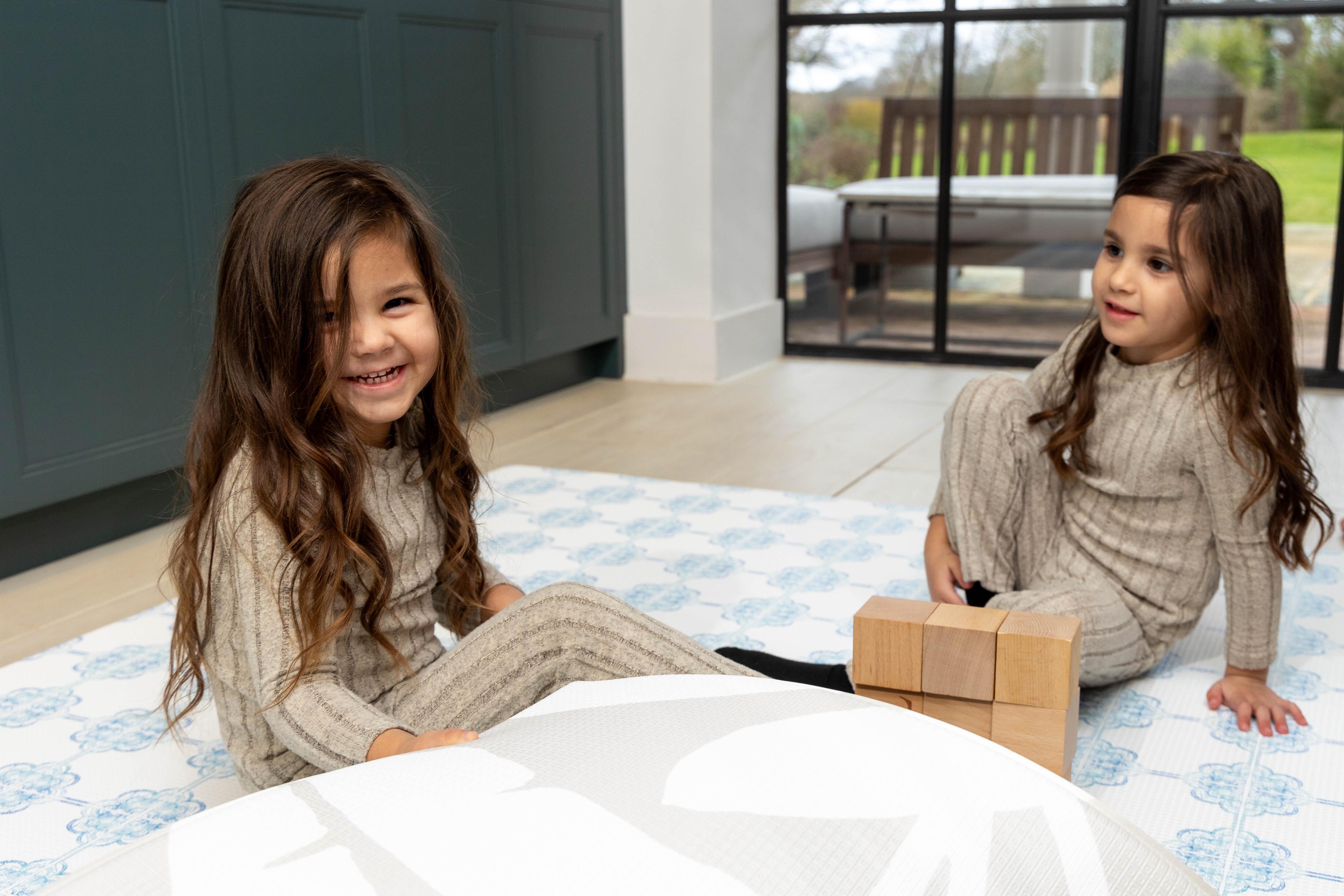 Lifestyle image of Santorini Breeze playmat – coastal-inspired neutral design complementing modern interiors