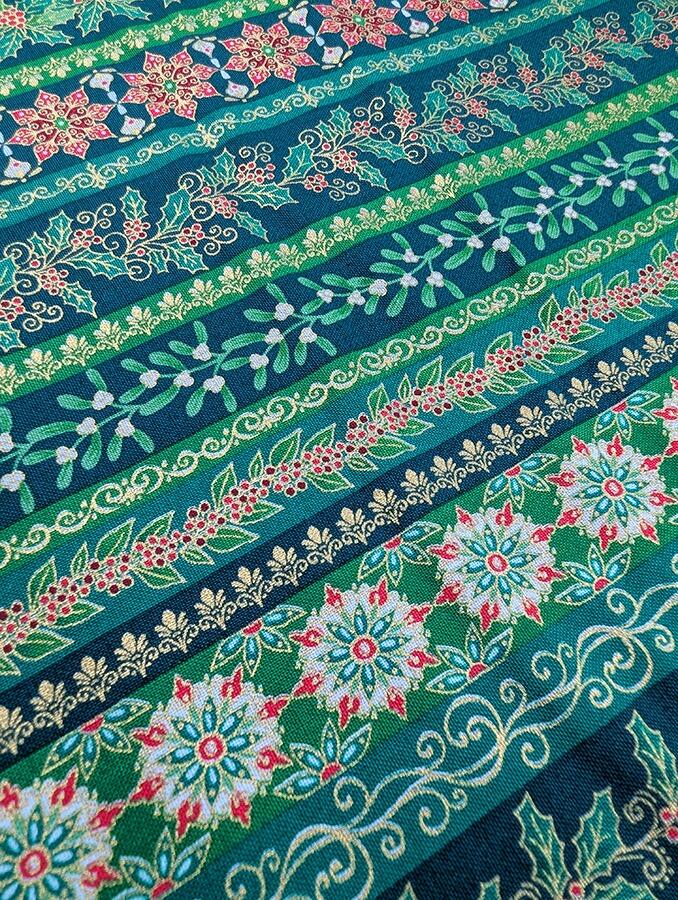 Makower Adorn, a traditional style Christmas fabric featuring gold metallic highlights.