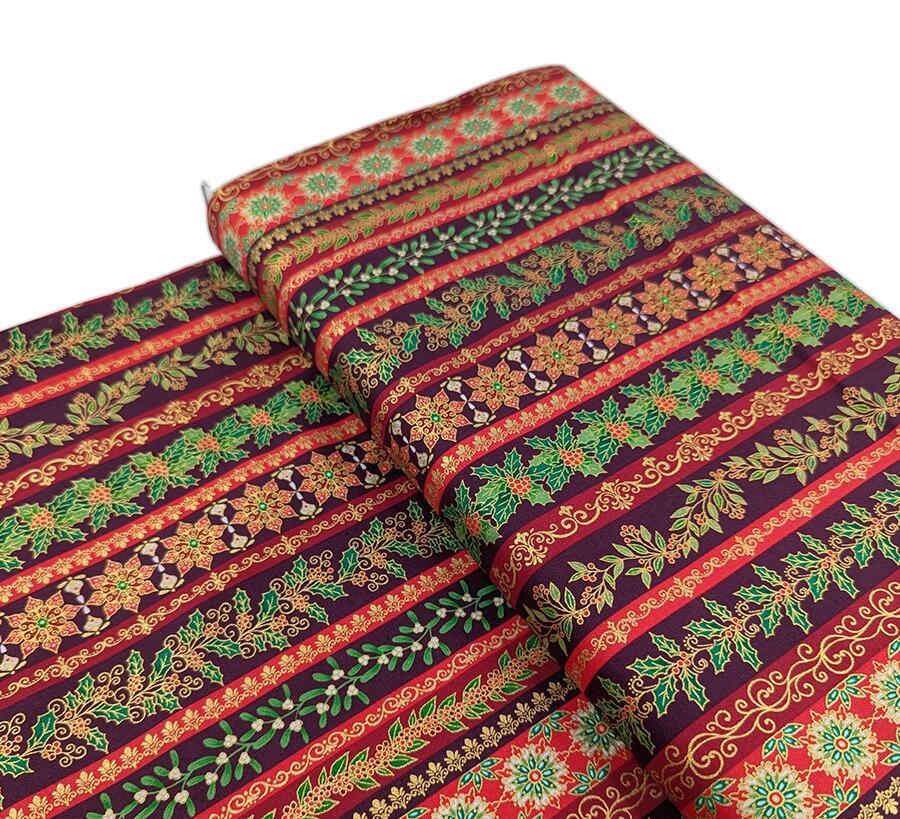 Makower Adorn, a traditional style Christmas fabric featuring gold metallic highlights.