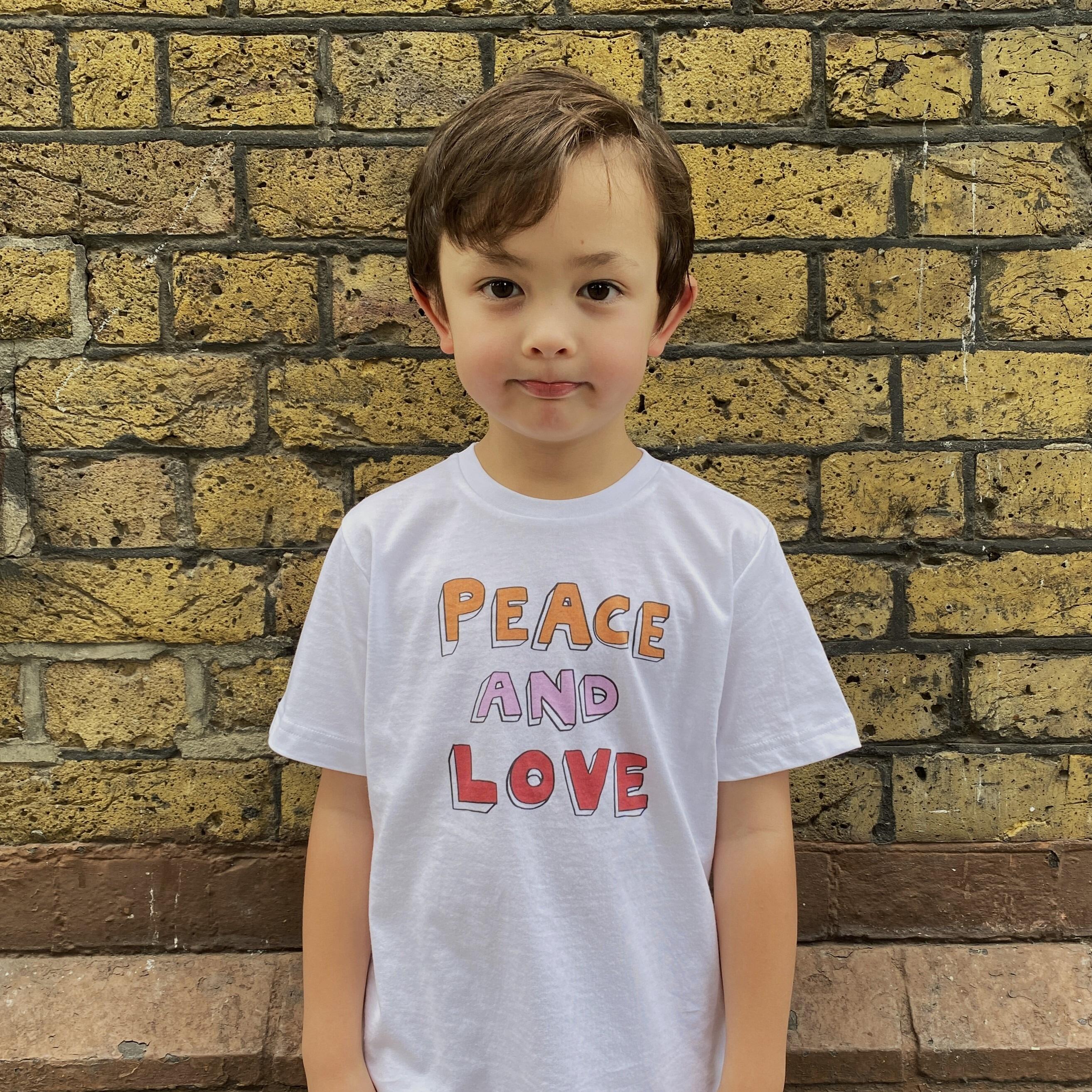A child wearing the Peace and Love t-shirt.