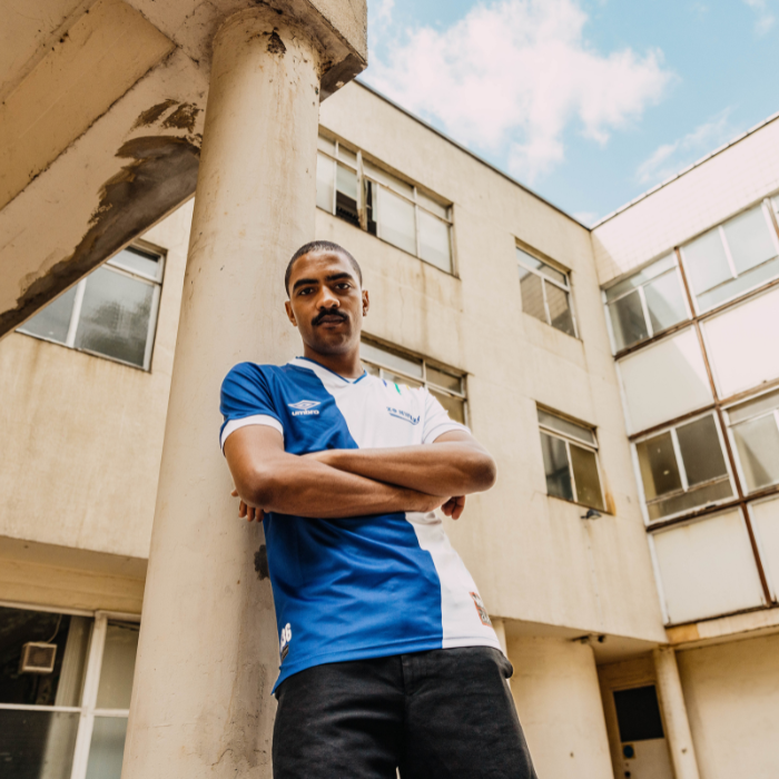 Person standing in front of a building wearing the shirt.