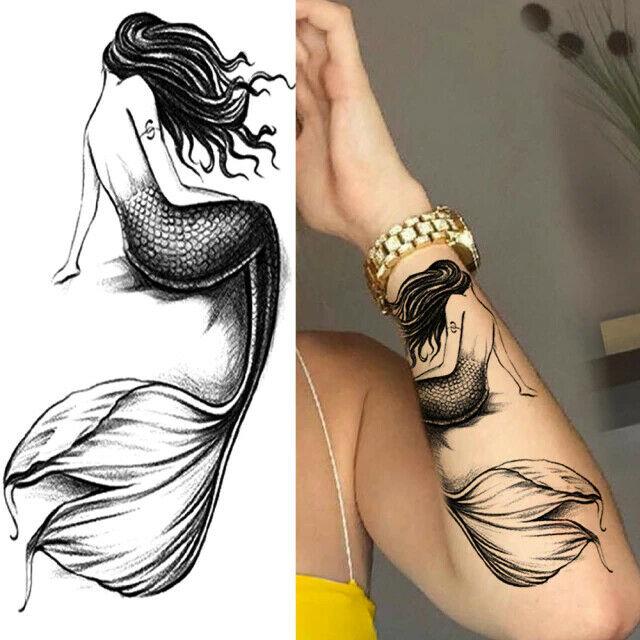 Mermaid tattoo on the thigh - Tattoogrid.net