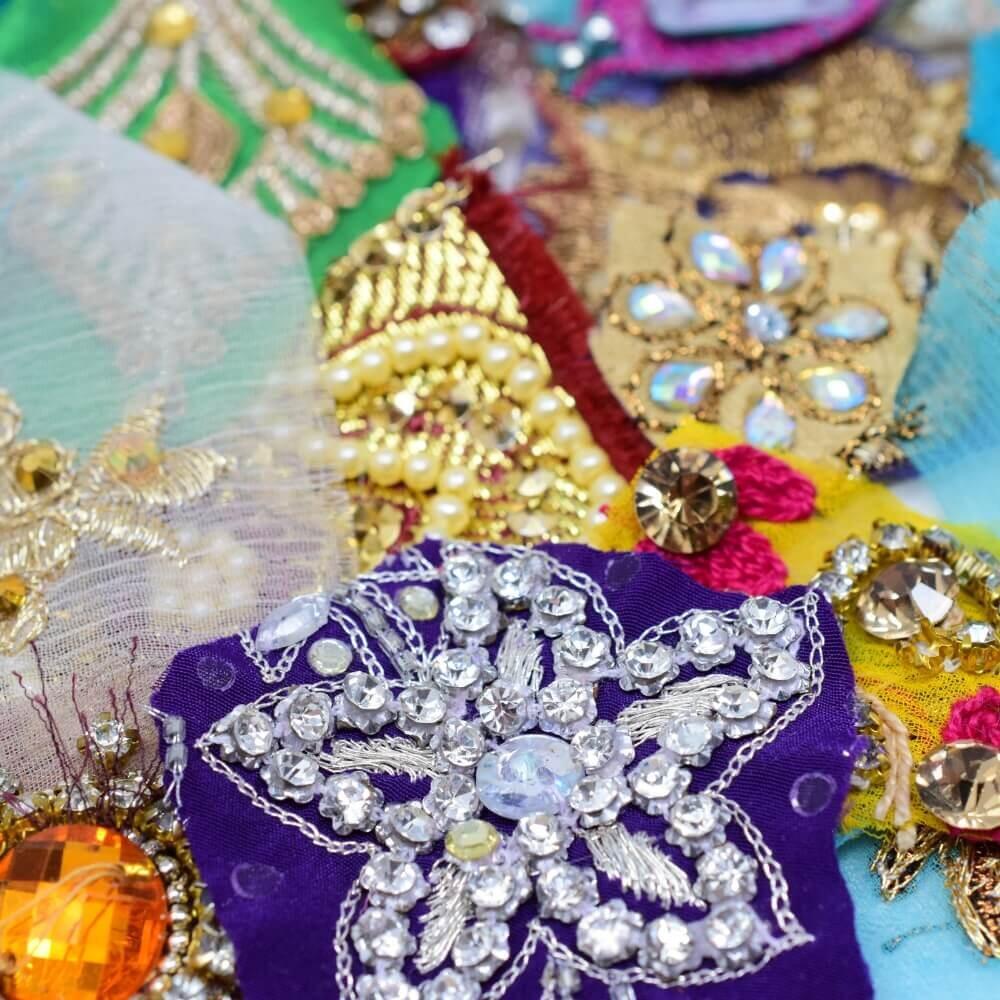 Macro shot of the sparkling diamante details on some colourful sari fabric motif embellishments