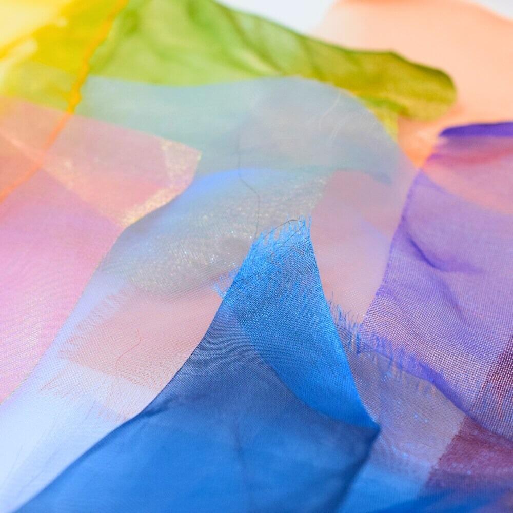 Close up detail of some sheer and colourful craft fabric scraps
