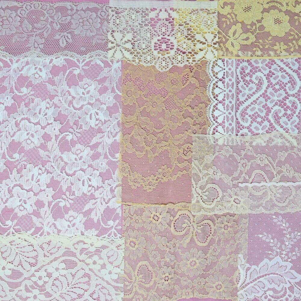 Flatlay of some pieces of off-white lace fabric and trim arranged in a square shape on a lilac background