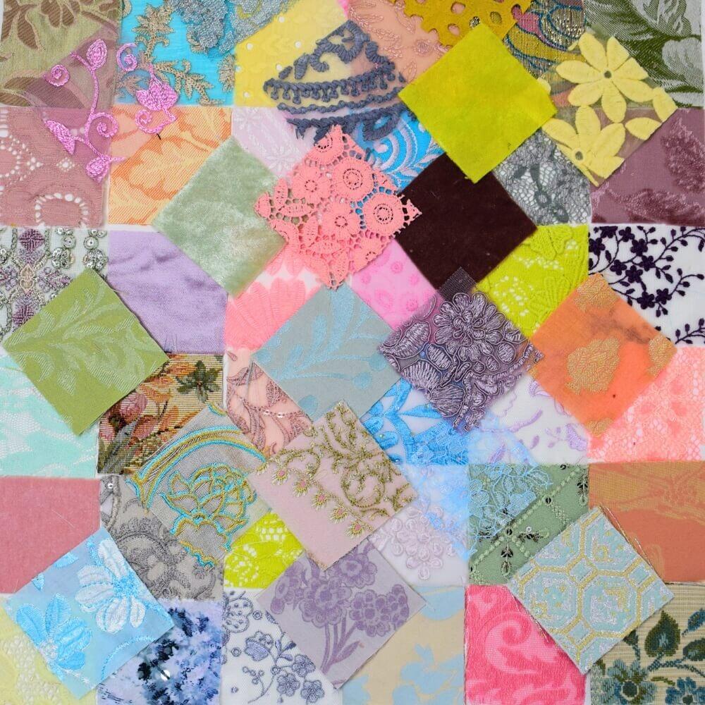 flat lay of a selection of pastel coloured textured fabric squares arranged like patchwork