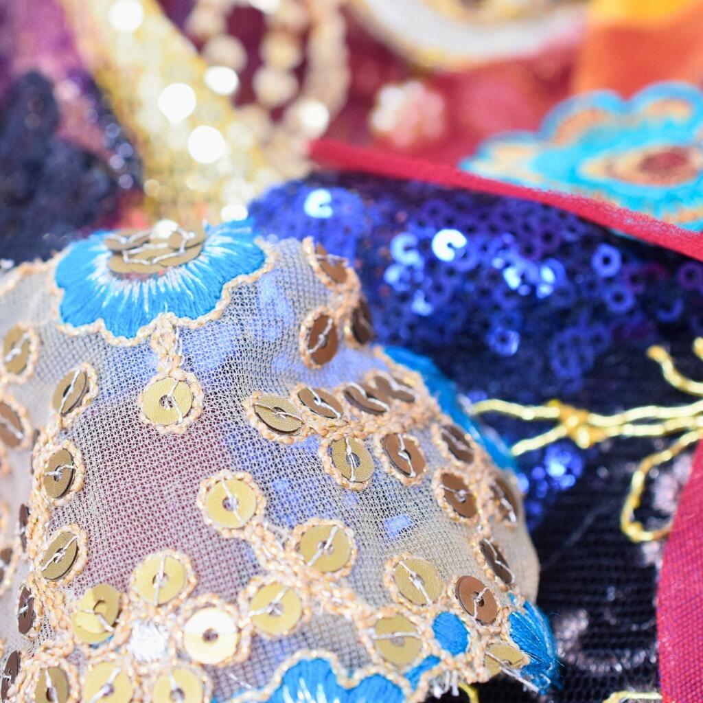 Macro detail of some sequinned and sparkly craft fabrics