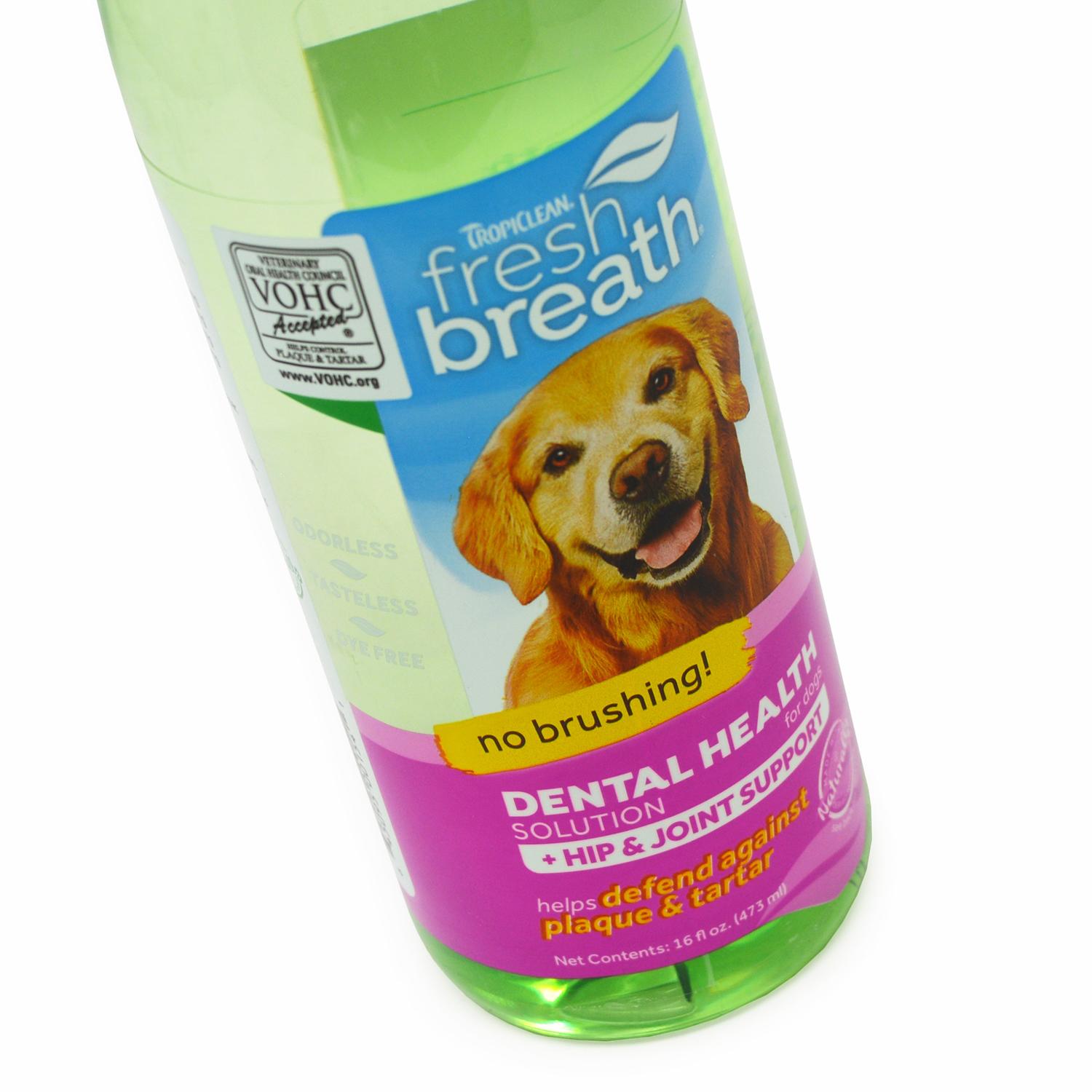 Close up of a bottle of TropiClean Pet Oral Care water for Hip and Joint Health
