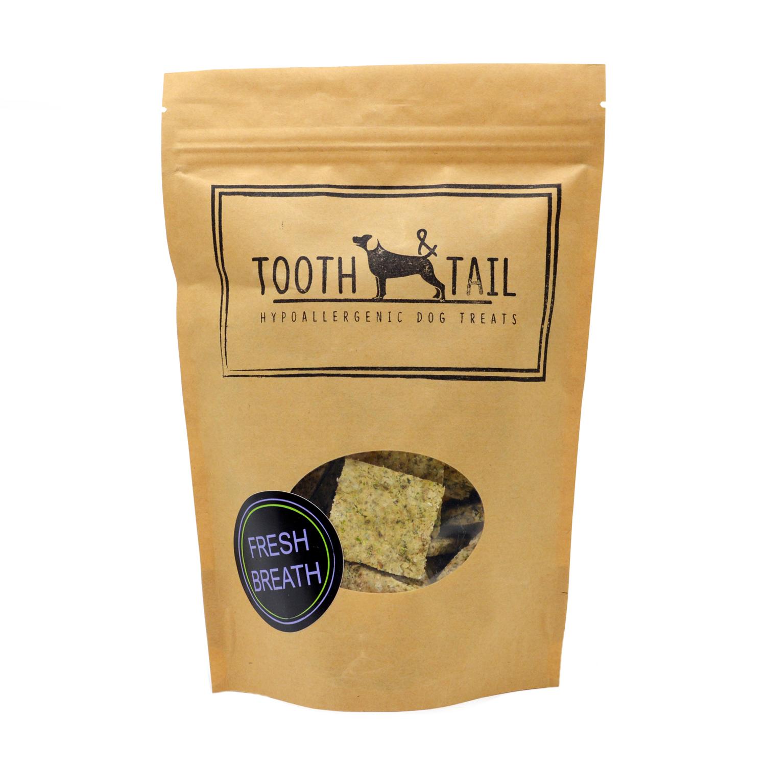 Front of a pack of Tooth and Tail Fresh Breath vegan dog biscuits