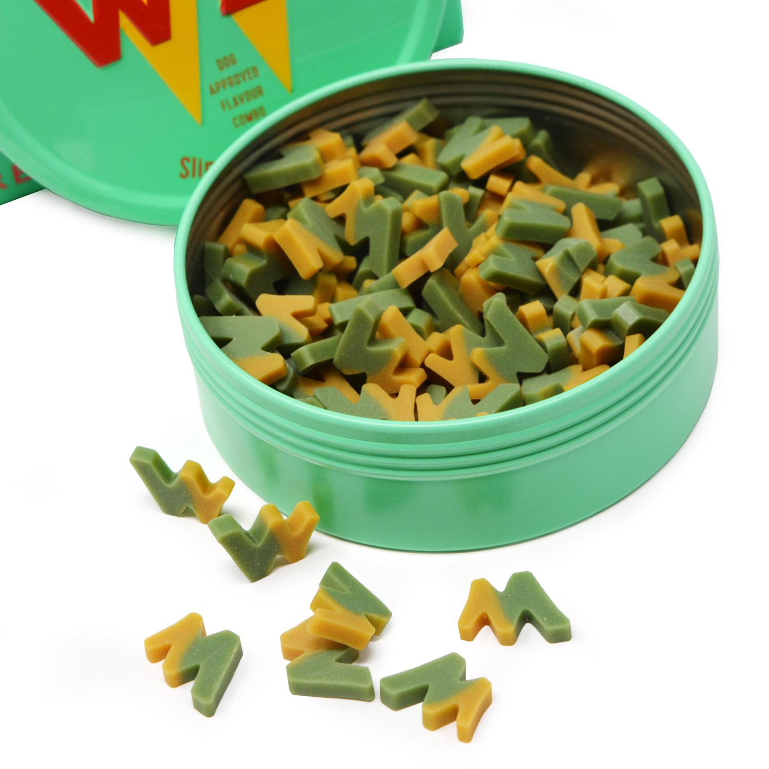 An open tin of W'ZIS slipper and biscuit plant based dog treats