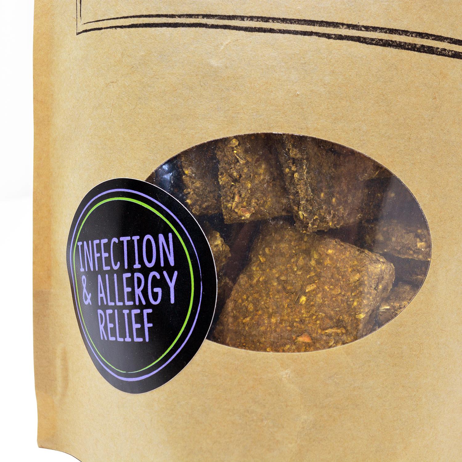 Close up of a pack of Tooth and Tail Infection and Allergy Relief vegan dog biscuits