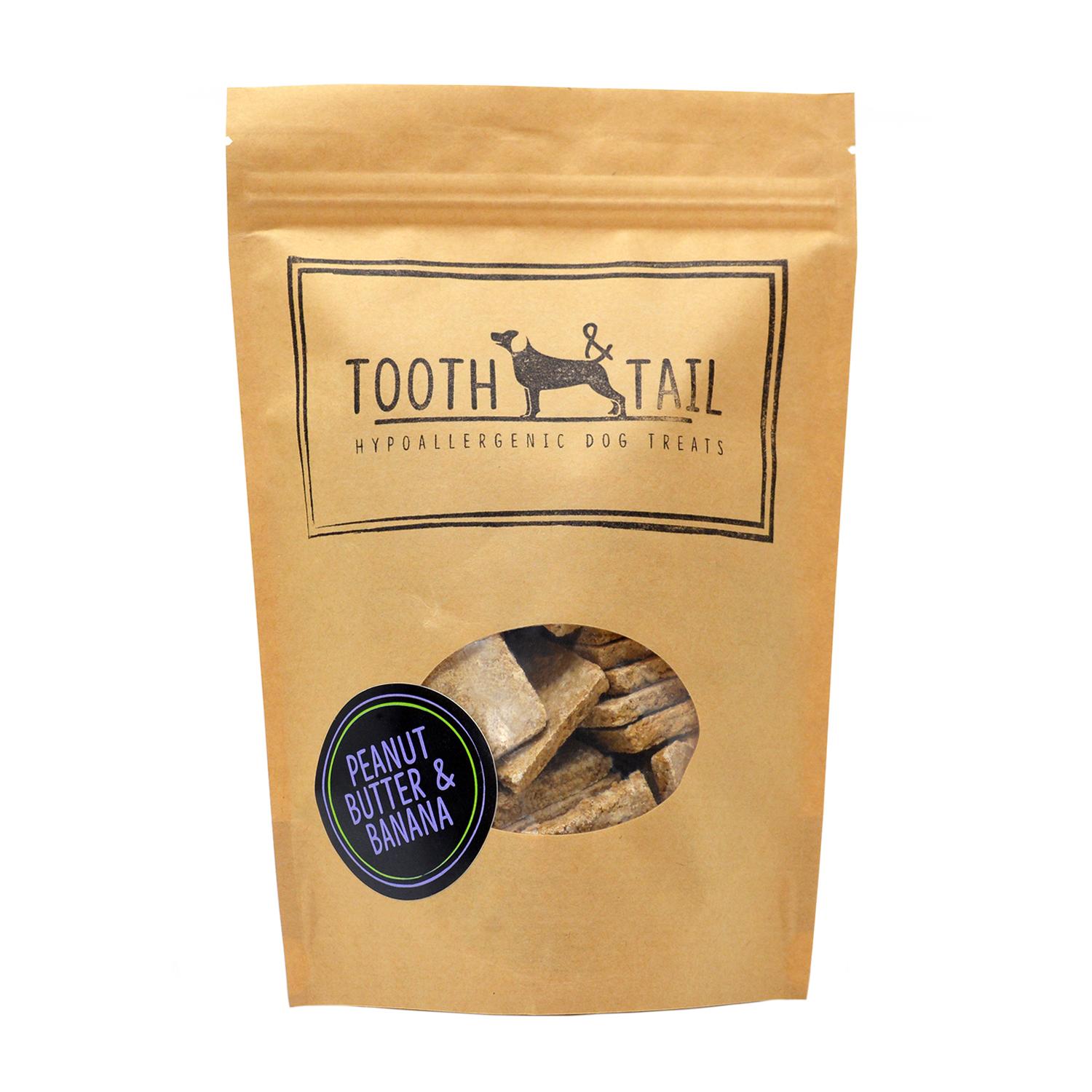 Front of a pack of Tooth and Tail Peanut Butter and Banana vegan dog biscuits