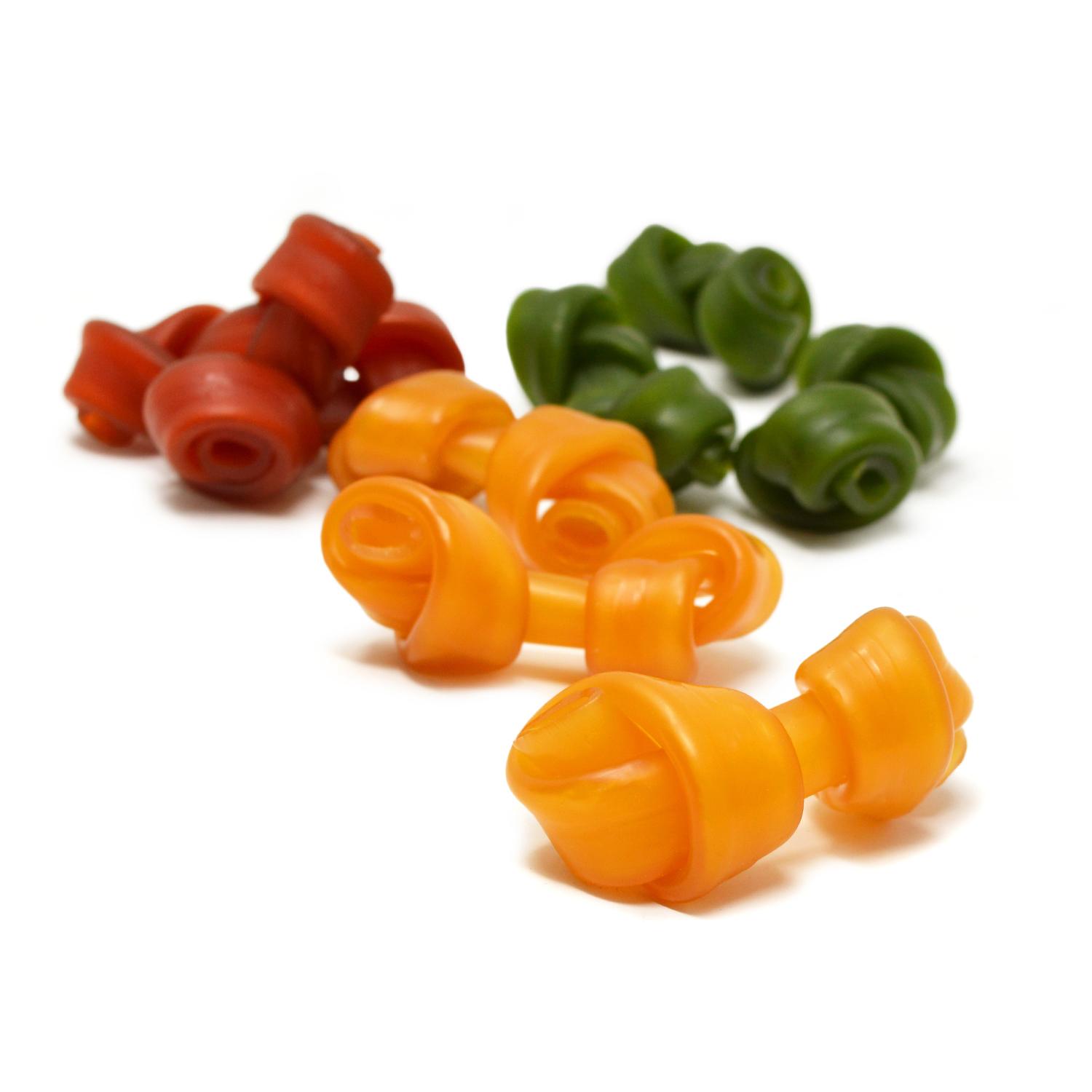 A selection of orange, green and purple grain free pawtato dog chews