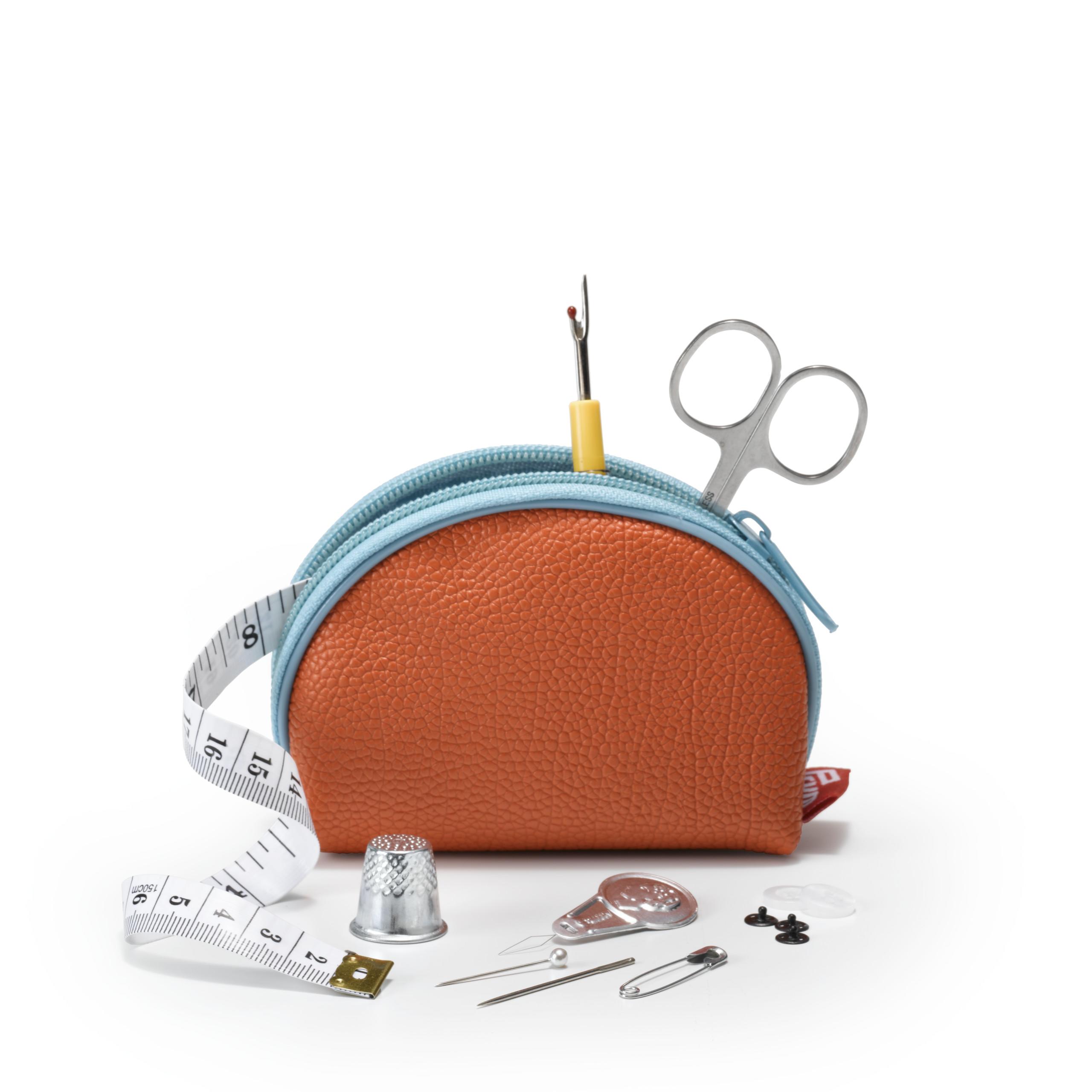An orange Prym Sewing kit