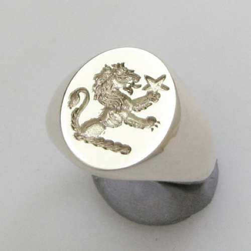 demi lion holding a star crest engraved silver signet ring