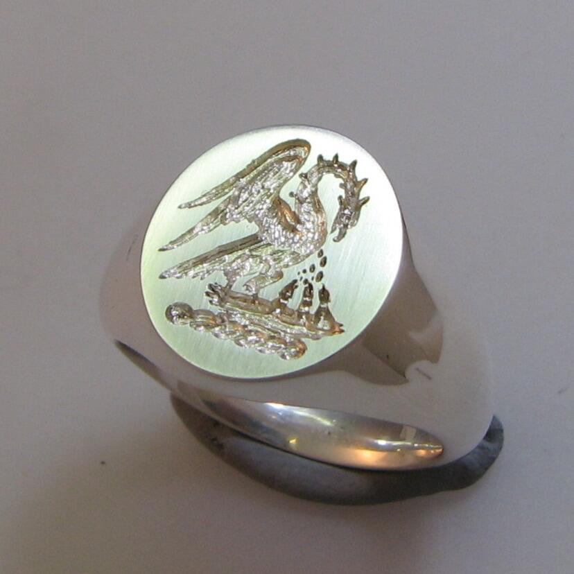 Pelican feeding chicks crest engraved silver signet ring