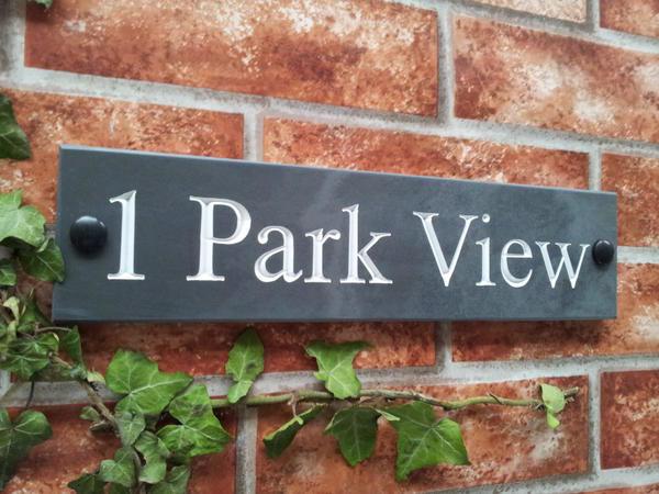 Slate house sign with address line and white inlay