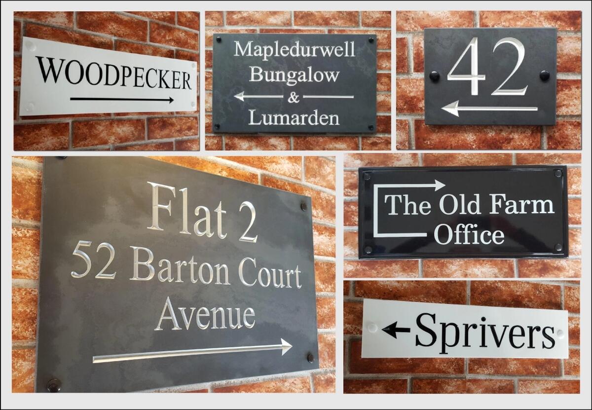 Display of house signs with directional arrows