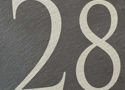 Example illustration of a riven slate house sign with a laser etched number 28