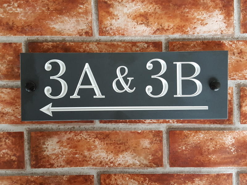 engraved direction sign in slate