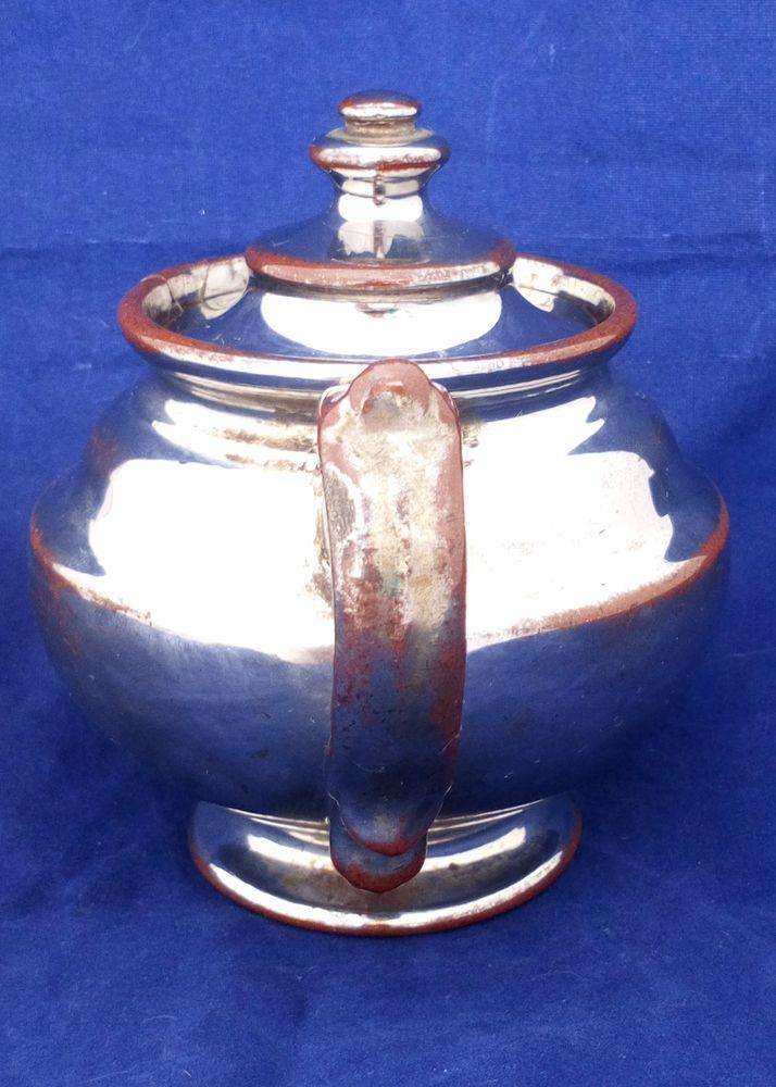 Victorian antique platinum lustre teapot with a shouldered round body on a pedestal foot and with a low collar, it is bachelor sized circa 1840