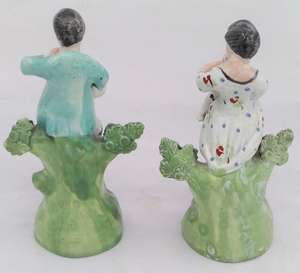 Antique Pair of Enamelled Pearlware Sherratt Style Bocage Figurines of Shepherd with Dog and Shepherdess with lamb circa 1820
