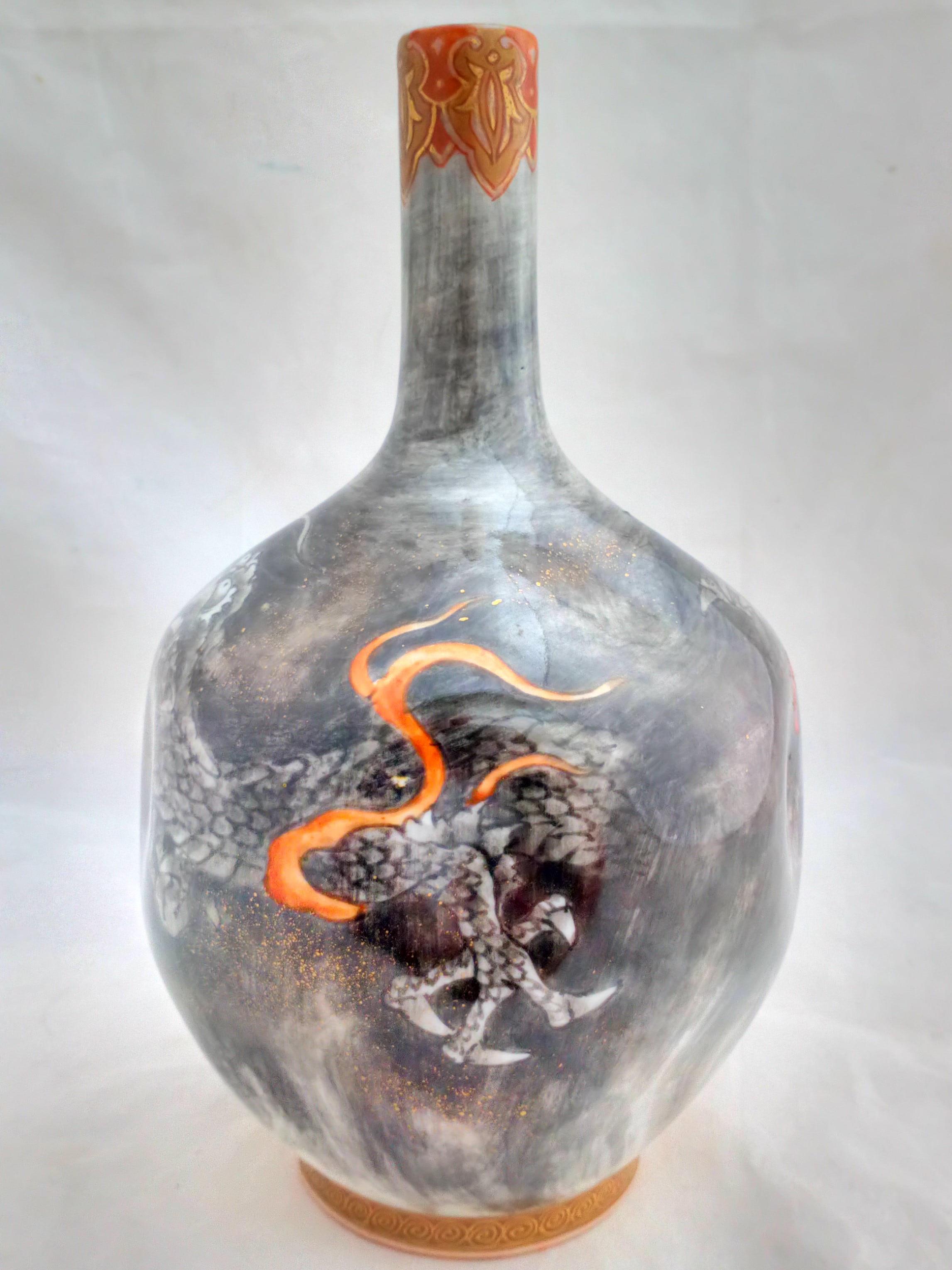Antique Meiji period Japanese Koransha Fukagawa porcelain bottle vase with dimpled sides decorated with a dragon in swirling clouds in greys and blacks (En Grisaille) circa 1880.