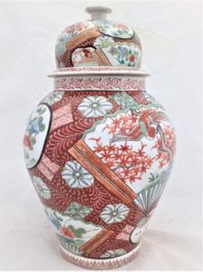 A large antique Japanese Hizen porcelain vase and cover marked Zoshuntei Saiho. Decorated in hand painted enamels with two large Japanese folding fans each painted with a colourful Asiatic Pheasant flying over a Japanese Acer.  This antique temple vase and cover dates from the mid 19th century circa 1860.