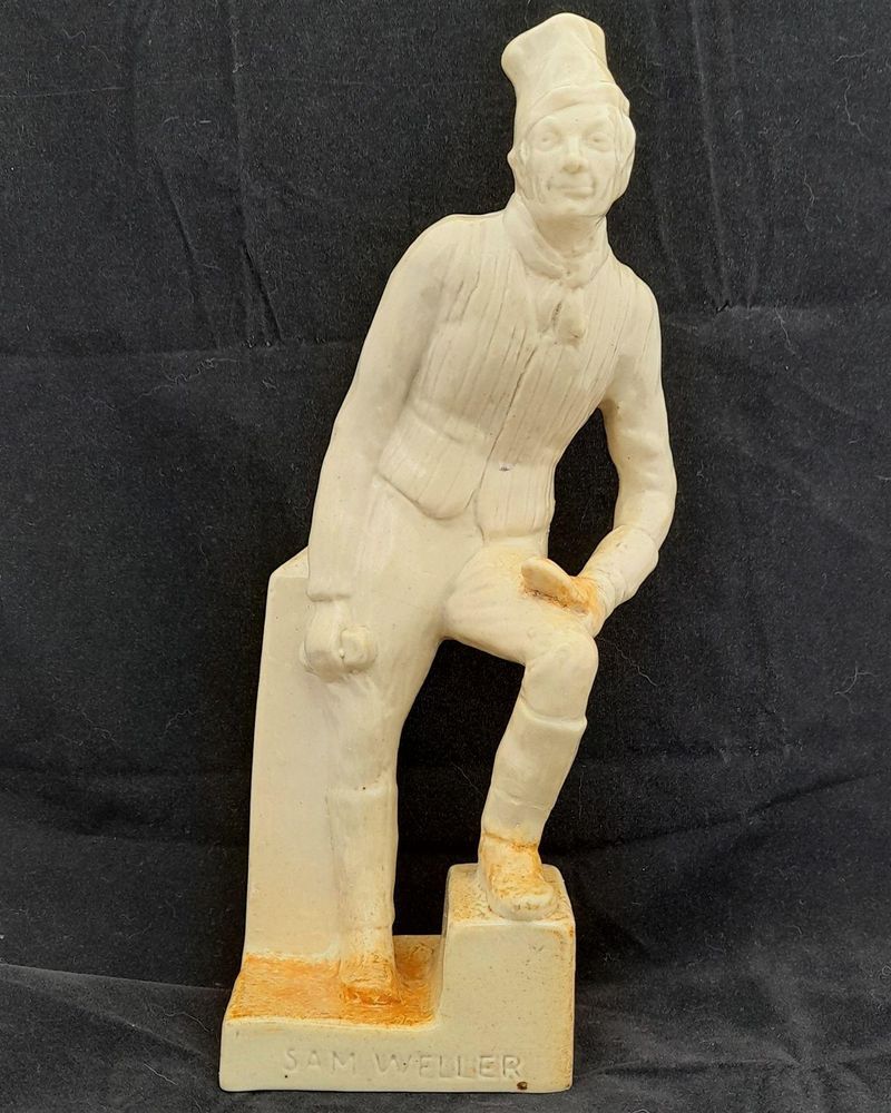 A rare antique buff coloured stoneware Royal Doulton Lambeth figurine model H 23 by Leslie Harradine modelled in 1912 - depicting Sam Weller from the novel Pickwick Papers by Charles Dickens