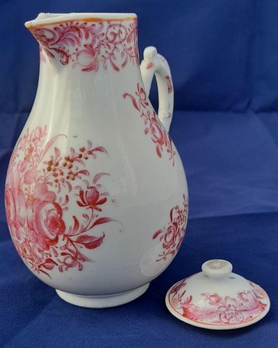 An antique Chinese porcelain lidded sparrow beak milk jug or creamer hand painted in puce with a floral pattern made in theperiod of the Chinese Emperor Qianlong in the Qing dynasty  circa 1760