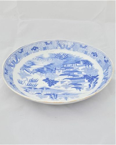 An antique Miles Mason type porcelain saucer dish transfer printed in blue and white in the Two Temples Broseley pattern circa 1810