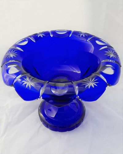 An antique late Victorian Bohemian flashed blue glass footed bowl - cut to clear with scalloped turn over rim circa 1900 14.6 cm high 19 cm diameter weighs 0.808 kg unpacked.