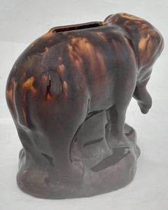 An antique novelty pottery elephant money box with a Rockingham type brown treacle glaze dates to the early 19th century - piggy bank in the form of a Jumbo elephant circa 1830 10. 3 cm high 12.6 cm long