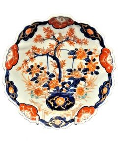Antique Japanese Arita Porcelain Plate Scalloped Hand Painted Imari Meiji circa 1900 - Pattern of a Bird sat in a potted Acer tree which in turn is sat upon a table which has dragon decoration.