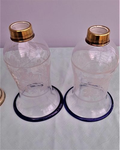 Pair of antique brass spring loaded hurricane candlesticks with grapevine etched glass shades with blue rim & cut glass prism lustre droppers 53 cm High 3.8 kg