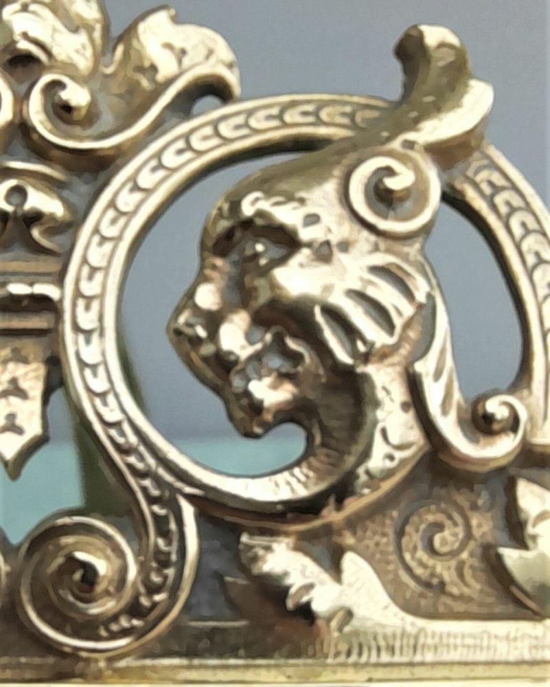 Antique Gothic Revival easel photo picture frame in high relief cast brass - decorated with helmeted leopards, the green man's head & ornate scrolls - for a landscape image size 6" x 4.5" - frame size 9" high, 10 inches wide by 8 inches deep, 19th century circa 1860. weighs 1156 grammes unpacked.