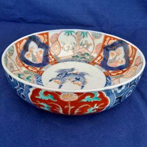 side on pattern image - Japanese Arita porcelain Imari pattern Bowl with Central Kirin & garden scenes - the base with double foot ring - antique late Edo period 19th C