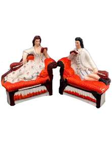 Pair Antique Victorian Staffordshire Pottery Flatback Figurines of a Male and Female Musician Recumbent on Chaise Longue or Sofas circa 1880