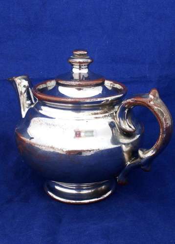 Victorian antique platinum lustre teapot with a shouldered round body on a pedestal foot and with a low collar, it is bachelor sized circa 1840