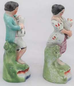 Antique Pair of Enamelled Pearlware Sherratt Style Bocage Figurines of Shepherd with Dog and Shepherdess with lamb circa 1820