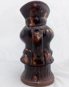 Antique pottery Rockingham brown treacle glazed toby jug known as the Snuff Taker 24 cm high dating from the 19th century circa 1880.