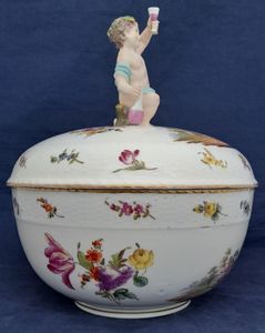 An antique Bacchus Handled dome lidded KPM Berlin Porcelain Punch Bowl with hand painted scenes based upon William Hogarth's satirical engravings and Deutsche Blumen, underglaze blue sceptre mark circa 1830 26.5 cm diameter 30.5 cm high.