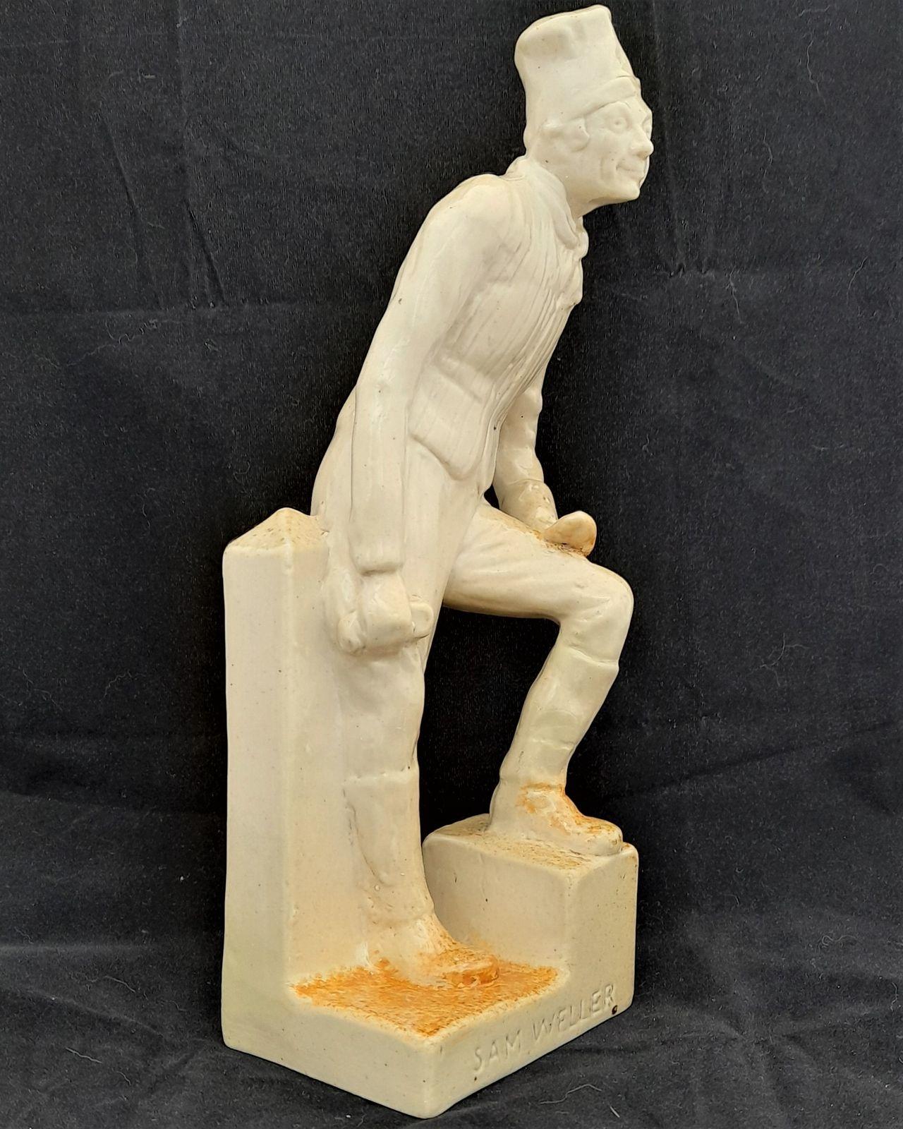 A rare antique buff coloured stoneware Royal Doulton Lambeth figurine model H 23 by Leslie Harradine modelled in 1912 - depicting Sam Weller from the novel Pickwick Papers by Charles Dickens