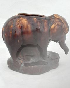 An antique novelty pottery elephant money box with a Rockingham type brown treacle glaze dates to the early 19th century - piggy bank in the form of a Jumbo elephant circa 1830 10. 3 cm high 12.6 cm long