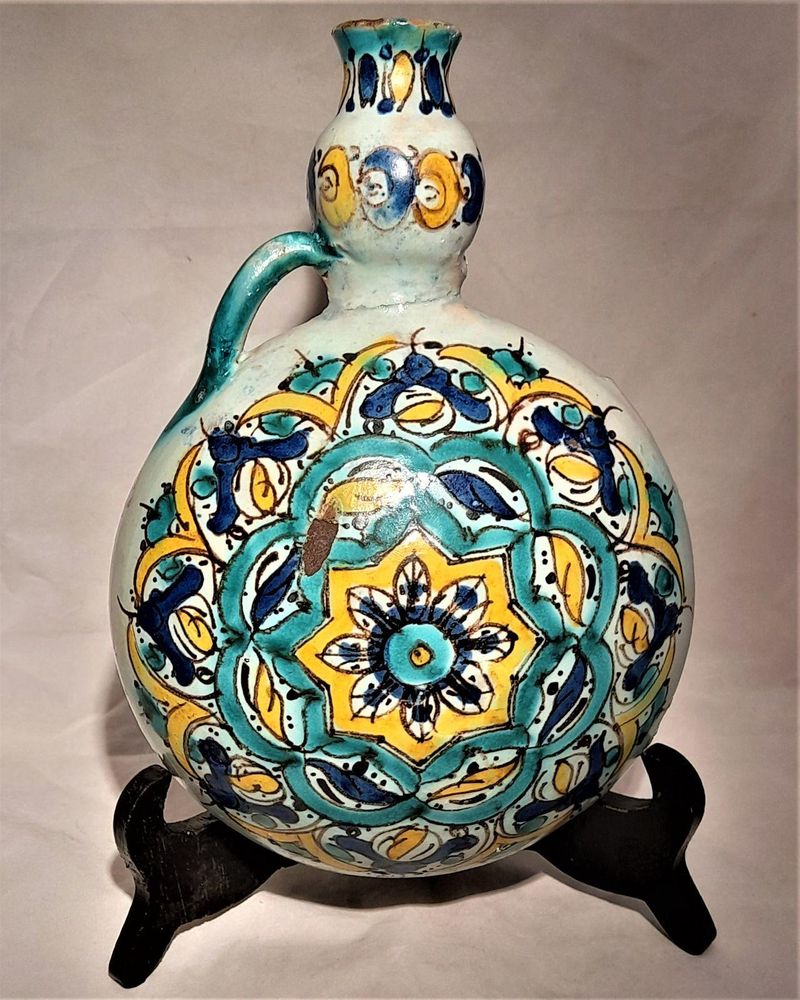 Moroccan tin glazed earthenware or faience pilgrim water flask antique 19th century hand painted with polychrome Arabesque foliate geometric pattern  727 grammes  9 inches long 6.5 inches wide  3 5/8 inches deep