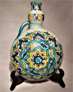 Moroccan tin glazed earthenware or faience pilgrim water flask antique 19th century hand painted with polychrome Arabesque foliate geometric pattern  727 grammes  9 inches long 6.5 inches wide  3 5/8 inches deep