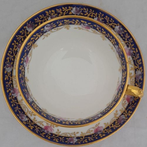 top view cup on the saucer - Antique porcelain tea cup & saucer hand painted blue rim & swagged pink roses by W. Lambert 1915 - Larcombe King St Derby on a Bishop & Stonier Blank